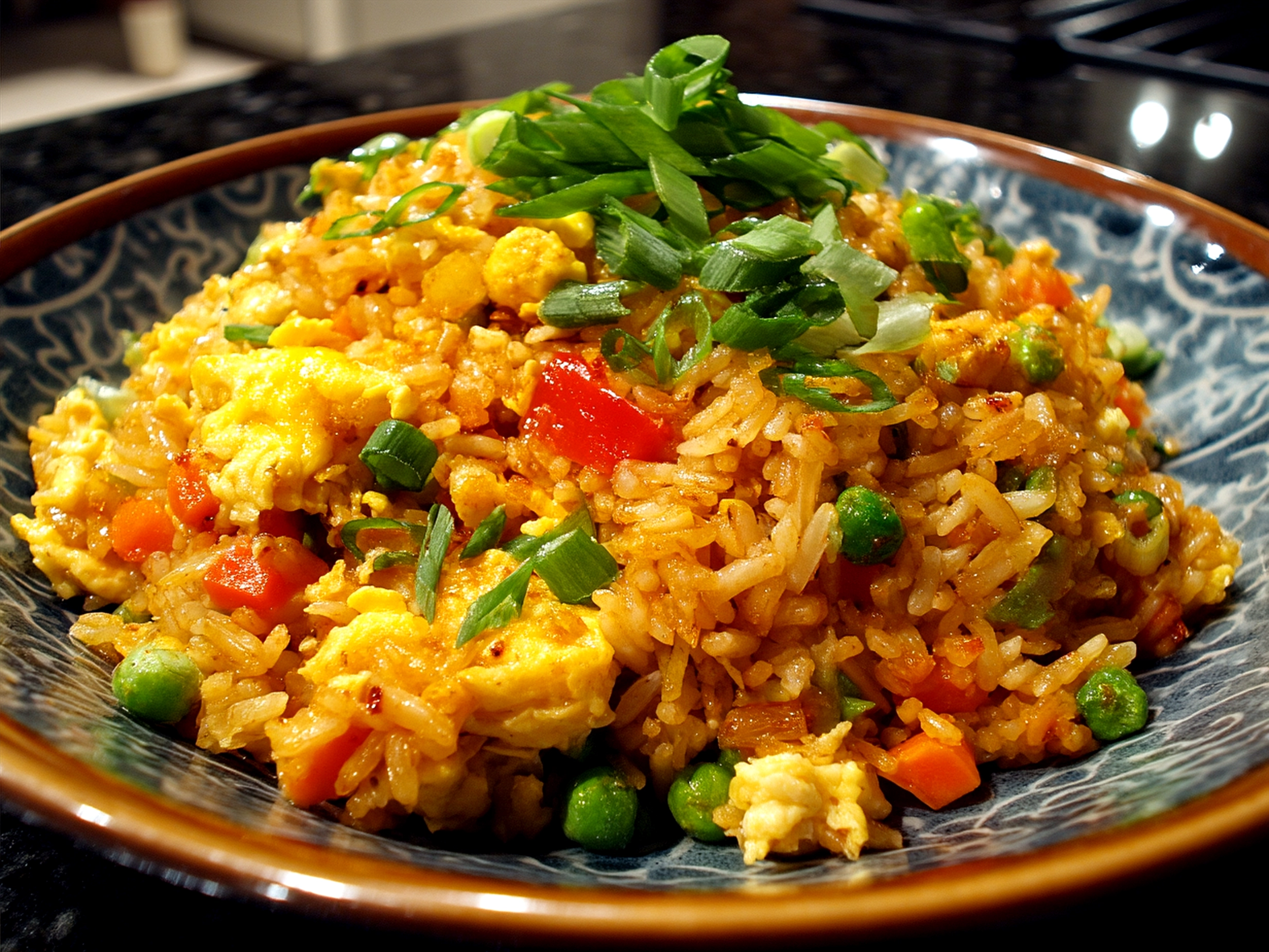 Serving Bang Bang Fried Rice garnished with green onions and sesame seeds